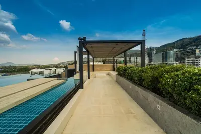 a swimming pool on the roof of a building at Top floor apartment at Aristo by Lofty in Surin Beach