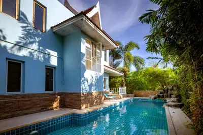 a house with a swimming pool next to a house at Mountain View Villa Kamala in Kamala Beach