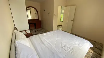 a bedroom with a white bed in a room at Mountain View Villa Kamala in Kamala Beach
