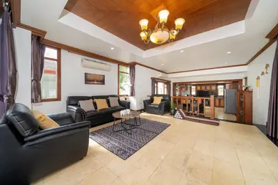 a living room with black leather furniture and a ceiling at Villa Aurora 4-bedroom Pool Villa in Kamala, Phuket in Kamala Beach