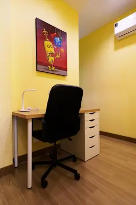an office with a desk and a black chair at Blue Moon by G Estate Phuket in Ban Saiyuan (1)
