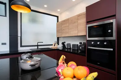 a kitchen with a bunch of fruit on a counter at LUXURY 4BR Oxygen Pool Villa Near Nai Harn Beach - Sunset Garden 7 in Rawai Beach