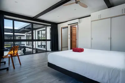 a bedroom with a white bed and a large window at LUXURY 4BR Oxygen Pool Villa Near Nai Harn Beach - Sunset Garden 7 in Rawai Beach