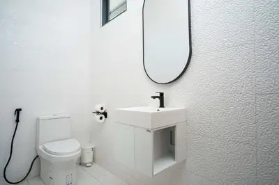 a white bathroom with a sink and a mirror at LUXURY 4BR Oxygen Pool Villa Near Nai Harn Beach - Sunset Garden 7 in Rawai Beach