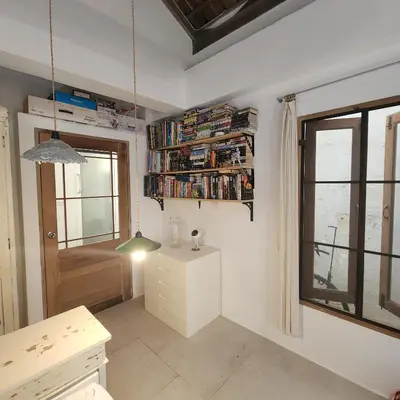 a small room with a desk and a window at The Hip House Villa Phuket in Ban Bang Khu