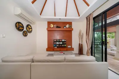 a living room with a white couch and a table at VIP Pool Villa 3E1 230m Rawai Beach in Rawai Beach