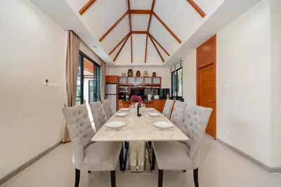 a dining room with a table and chairs at VIP Pool Villa 3E1 230m Rawai Beach in Rawai Beach