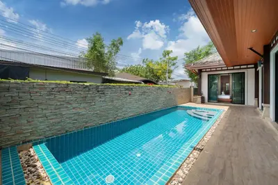 a swimming pool in the backyard of a house at VIP Pool Villa 3E1 230m Rawai Beach in Rawai Beach
