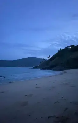 a beach with footprints in the sand at Jungle house at Yanui beach in Rawai in Phuket Town