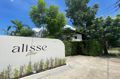 a sign for anissa spa in front of a house at Alisse Stay Phuket Layan in Phuket Town