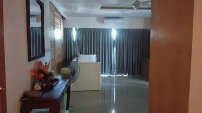a room with a hallway with a table and a room with a unintention at Patong tower 2bedroom 2 bathrooms, corner view in Patong Beach