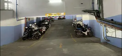 a group of motorcycles parked in a garage at Patong tower 2bedroom 2 bathrooms, corner view in Patong Beach