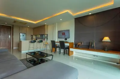 a living room with a couch and a table at C260 Beach And Town, Modern Big Apartment in Phuket Town