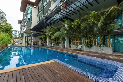 a large swimming pool in the middle of a building at C260 Beach And Town, Modern Big Apartment in Phuket Town
