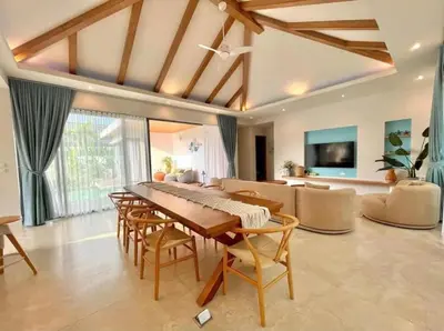 a living room with a table and chairs and a couch at 3 Bed Bang Tao pool villa at The Lux in Phuket Town