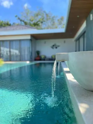a water fountain in a swimming pool at 3 Bed Bang Tao pool villa at The Lux in Phuket Town