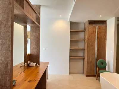a room with a wooden desk and a green chair at 3 Bed Bang Tao pool villa at The Lux in Phuket Town