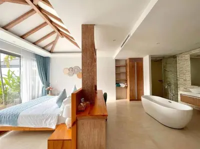 a bedroom with a large bed and a bath tub at 3 Bed Bang Tao pool villa at The Lux in Phuket Town