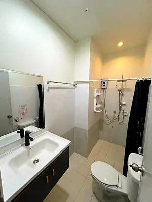 a bathroom with a sink and a toilet and a shower at Fora Boutique Hotel in Karon Beach