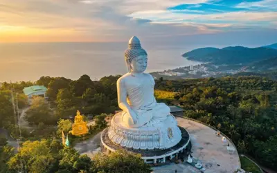 a large statue sitting on top of a mountain at Ozone Phuket Kata Beach Resort & Wellness in Kata Beach