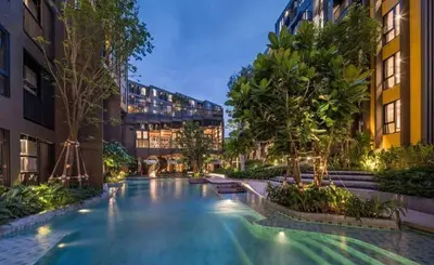 a swimming pool in the middle of a building at PRIME TOWN Phuket Resort & Wellness in Ban Rangeng