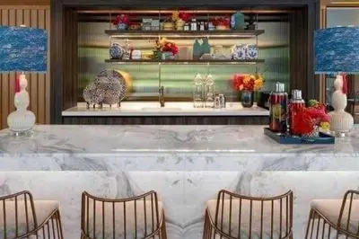 a bar with chairs and a counter with vases at PRIME TOWN Phuket Resort & Wellness in Ban Rangeng