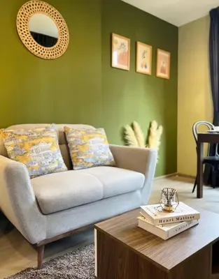 a living room with a couch and a coffee table at THE BASE CENTRAL Phuket Shopping Mall Central Floresta in Ban Rangeng