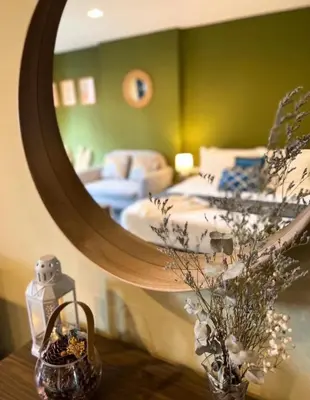 a room with a mirror and a bedroom with a bed at THE BASE CENTRAL Phuket Shopping Mall Central Floresta in Ban Rangeng