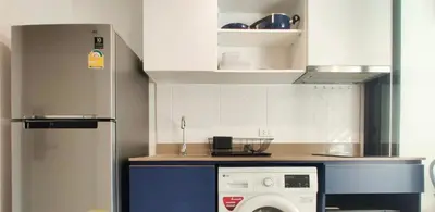 a kitchen with a washing machine and a refrigerator at THE BASE CENTRAL Phuket Shopping Mall Central Floresta in Ban Rangeng