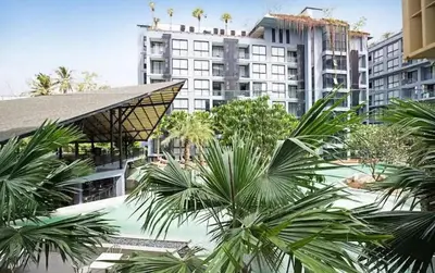 an overhead view of a hotel with palm trees and buildings at Citygate Kamala Resort & Residence in Kamala Beach