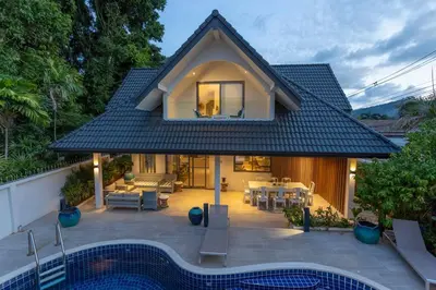 a house with a pool in front of it at Brand new, designer furnishing, hot tub, gym, pool V98 in Rawai Beach