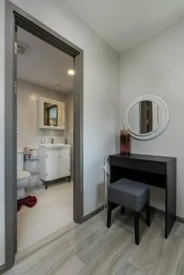 a bathroom with a sink and a desk and a mirror at A1 The Title Nayang Стильная квартира in Nai Yang Beach