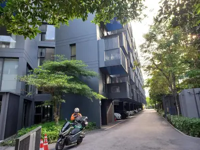 a scooter parked on a street next to a building at The Deck Condo Patong 7th Fl Mountain View1 in Patong Beach