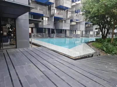 a swimming pool in front of a building at The Deck Condo Patong 7th Fl Mountain View1 in Patong Beach