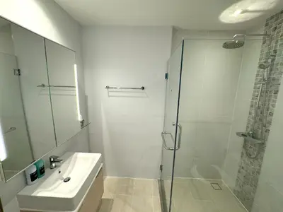 a bathroom with a shower and a sink at Modern 2br apartment near Bangtao beach in Bang Tao Beach