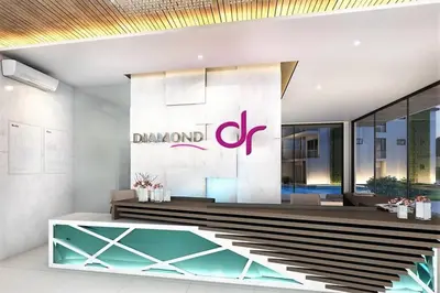 a lobby of a building with a sign on the wall at Modern 2br apartment near Bangtao beach in Bang Tao Beach