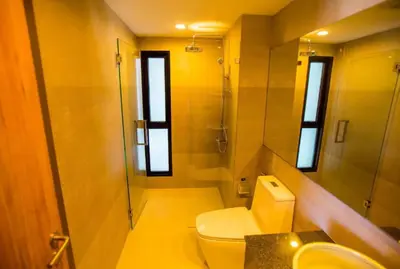 a bathroom with a toilet and a shower and a sink at Title Rent Rawai in Rawai Beach