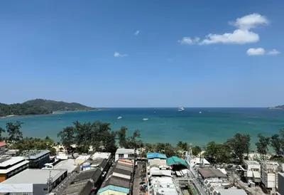 an aerial view of a city with the ocean at Sea view apartment with jacuzzi at Patong Tower in Patong Beach