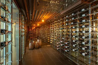 a wine cellar with a bunch of wine bottles at Villa W Luxury in Nai Harn Beach