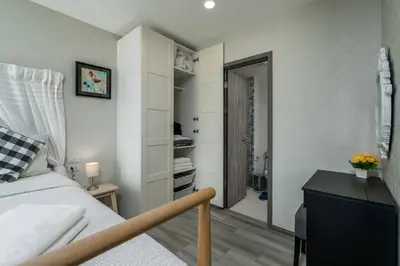 a bedroom with a bed and a walk in closet at С1O Новые Рубль ватсап669З582I976 in Nai Yang Beach
