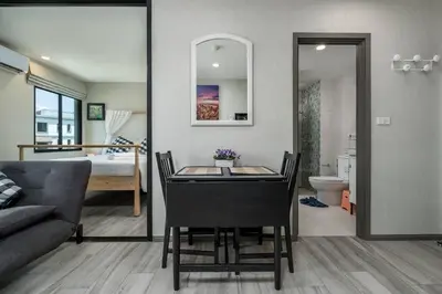 a living room with a table and a couch and a bedroom at С1O Новые Рубль ватсап669З582I976 in Nai Yang Beach