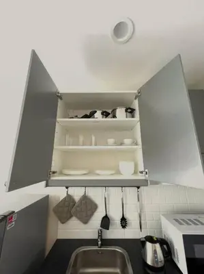 a kitchen with a sink and a shelf with utensils at B4 БАССЕЙН ВаТСАП669З582I976 in Nai Yang Beach