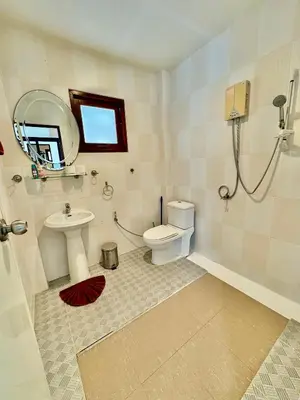 a bathroom with a toilet and a sink at Amazing 4BR pool villa near beach Bangtao in Ban Thalat Choeng Thale