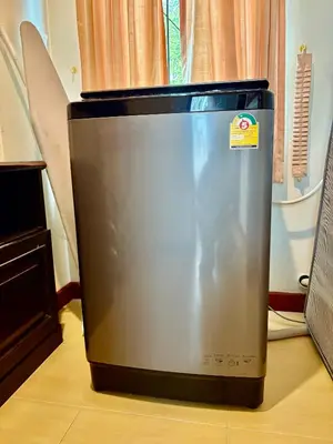 a refrigerator sitting on the floor in a room at Amazing 4BR pool villa near beach Bangtao in Ban Thalat Choeng Thale