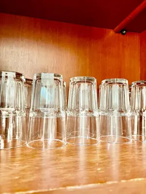 a row of empty glasses sitting on a table at Amazing 4BR pool villa near beach Bangtao in Ban Thalat Choeng Thale