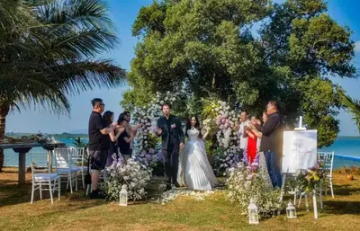 a wedding ceremony on the beach with people at Mai Khao Beach Luxury 7-bedroom villa 0 meters from the sea double infinity pool maid, outdoor wedding sea fishing in Mai Khao Beach