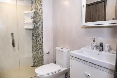 a bathroom with a toilet and a sink and a shower at G14 SuperKingSizeBed 1этаж тихая сторона in Nai Yang Beach