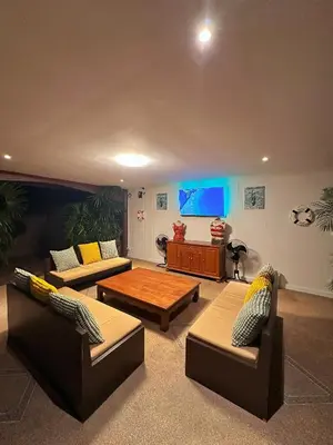 a living room with two couches and a table at Lovely,Private 7 bedroom pool villa Kamala in Kamala Beach