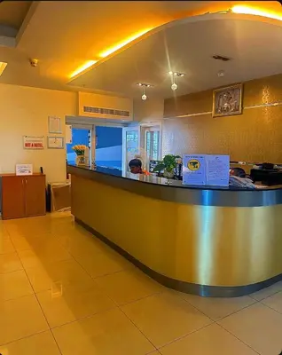 a lobby with a large counter in a restaurant at Patong Tower Apartments By Tida in Patong Beach