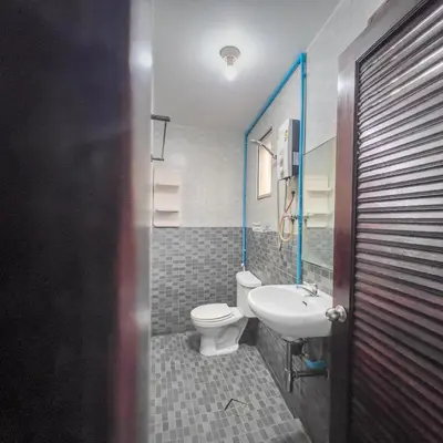 a bathroom with a toilet and a sink at Happy House in Phi Phi Don